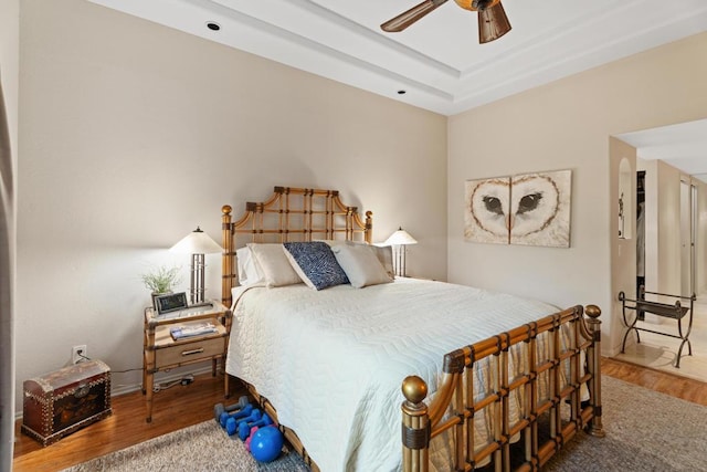 bedroom featuring ceiling fan and hardwood / wood-style floors