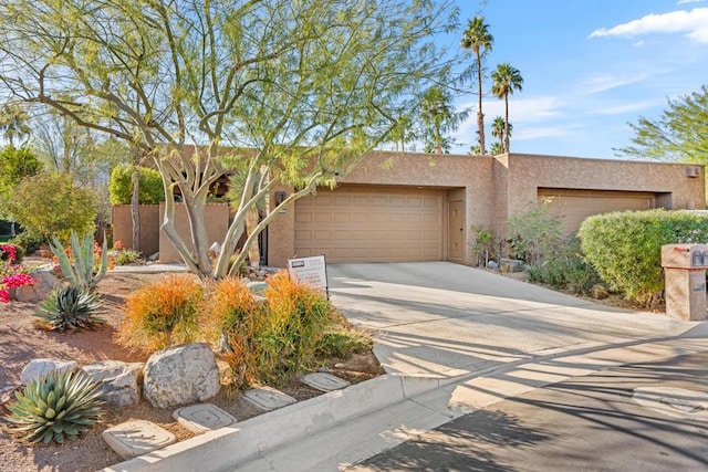 adobe home featuring a garage