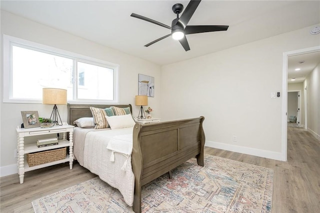 bedroom featuring ceiling fan and light hardwood / wood-style floors