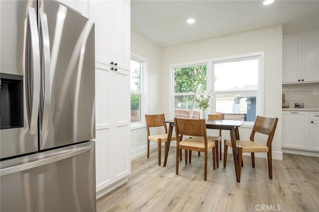 dining room with light wood-type flooring