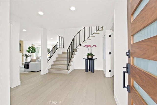 foyer with light hardwood / wood-style floors