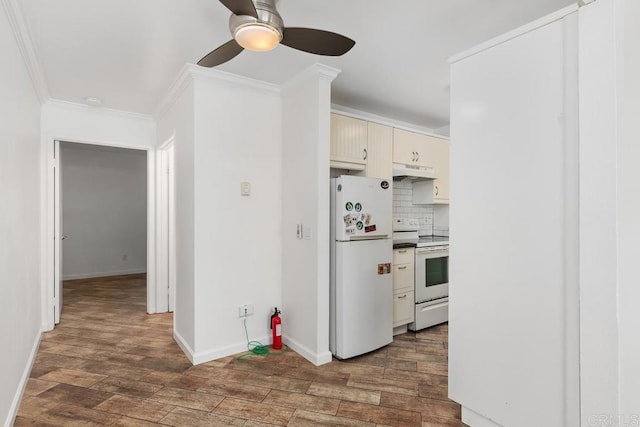 kitchen with white appliances, decorative backsplash, cream cabinets, ceiling fan, and crown molding