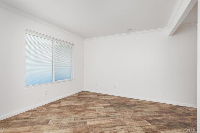 empty room featuring crown molding