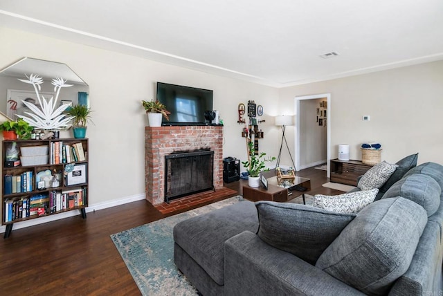 living room featuring a fireplace and dark hardwood / wood-style flooring