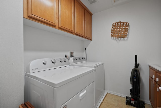 washroom with cabinets and independent washer and dryer