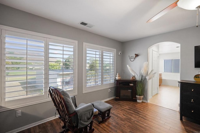 sitting room with hardwood / wood-style flooring and ceiling fan