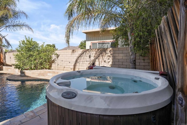 view of pool featuring a hot tub