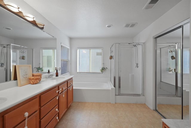 bathroom featuring independent shower and bath and vanity