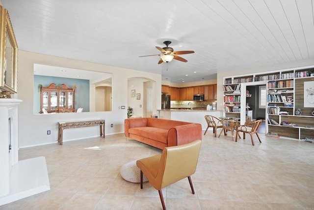 tiled living room with wooden ceiling and ceiling fan