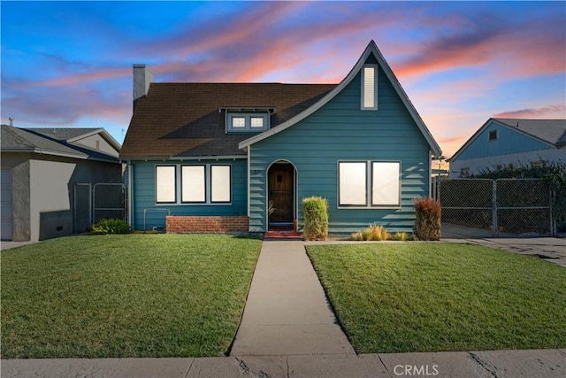 view of front of house with a lawn