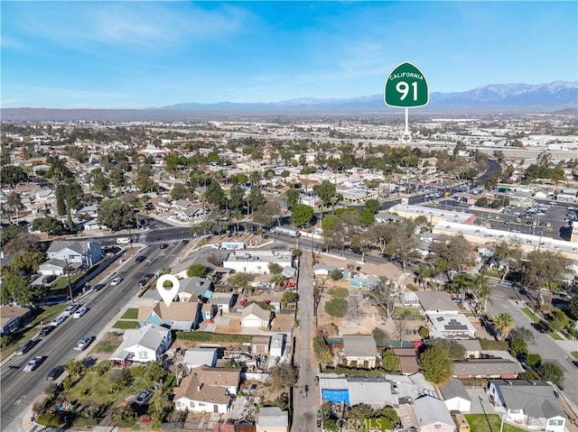 birds eye view of property with a mountain view