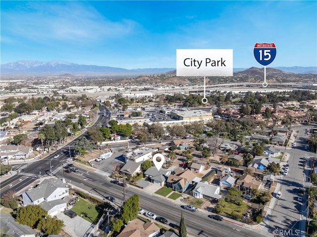 birds eye view of property featuring a mountain view