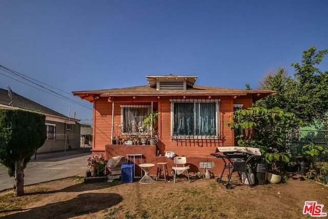 rear view of property with a patio area