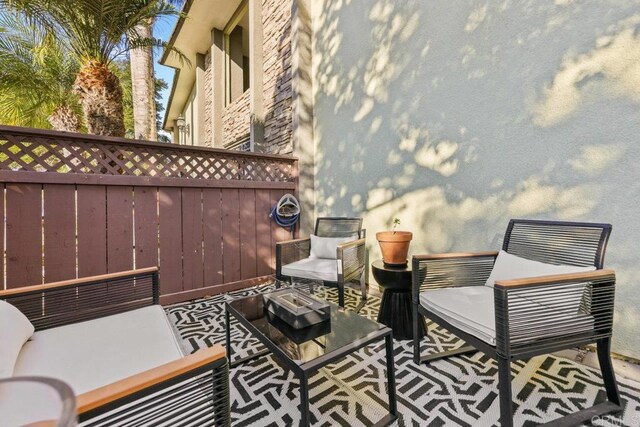 view of patio / terrace with an outdoor living space with a fire pit