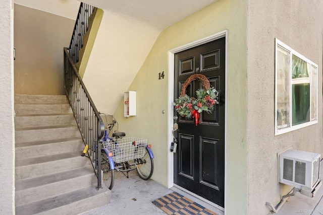 entrance to property featuring a wall mounted air conditioner