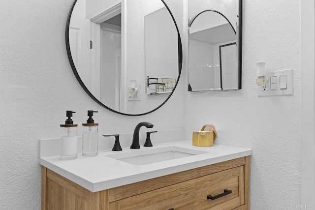 6602 Beadnell Way Unit 14, San Diego, CA 92117 - bathroom featuring vanity and a textured wall