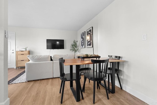 6602 Beadnell Way Unit 14, San Diego, CA 92117 - dining area featuring light wood finished floors and baseboards
