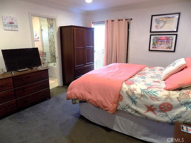 carpeted bedroom featuring crown molding and ensuite bath