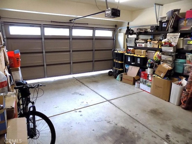 garage featuring a garage door opener