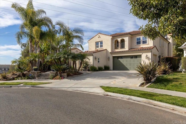 mediterranean / spanish-style house featuring a garage