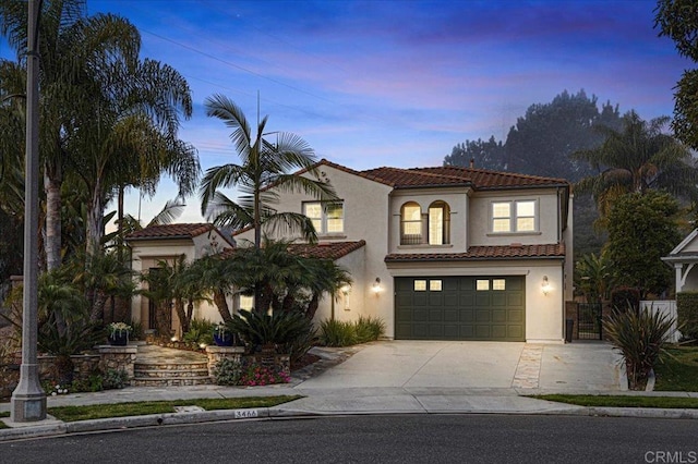 mediterranean / spanish-style house featuring a garage