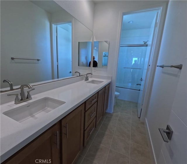 full bathroom featuring tile patterned floors, shower / tub combination, toilet, and vanity