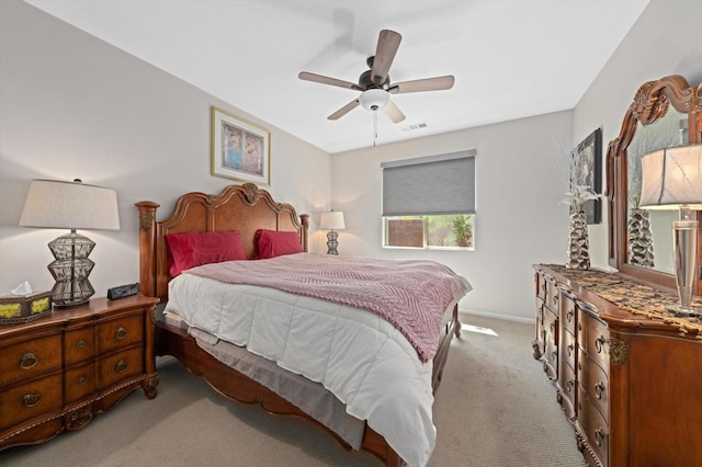 bedroom with ceiling fan and light colored carpet