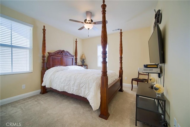 bedroom with light carpet and ceiling fan