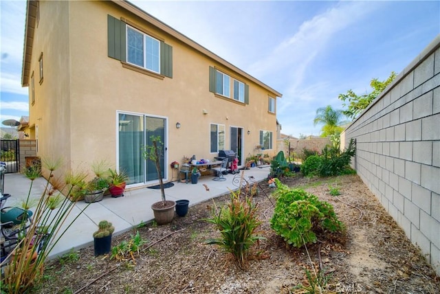 rear view of house with a patio area