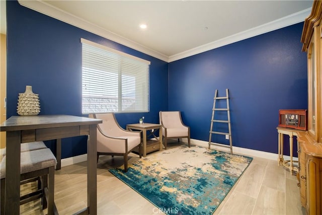 living area with wood-type flooring and crown molding