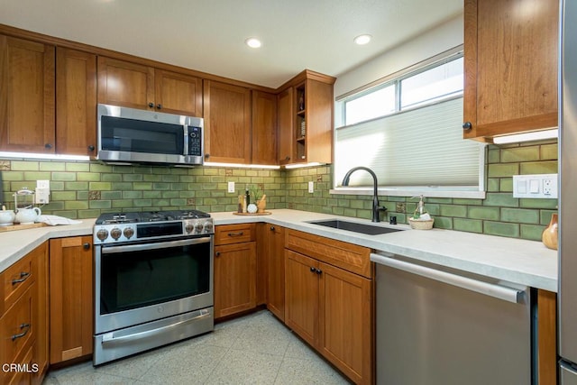 kitchen with sink, backsplash, and stainless steel appliances