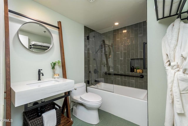 full bathroom with toilet, bath / shower combo with glass door, and sink