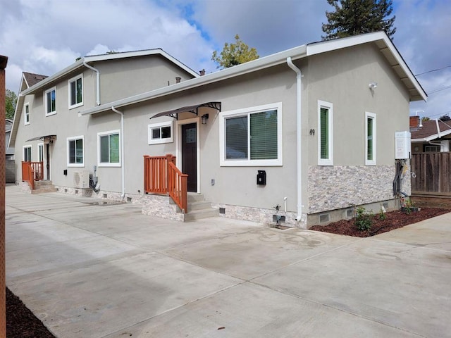 rear view of property featuring a patio