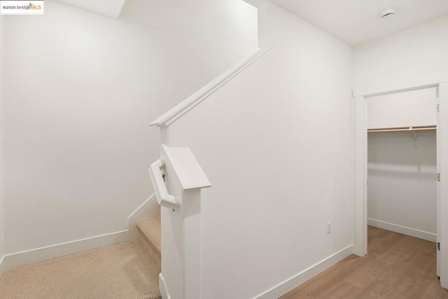 spacious closet featuring light hardwood / wood-style floors