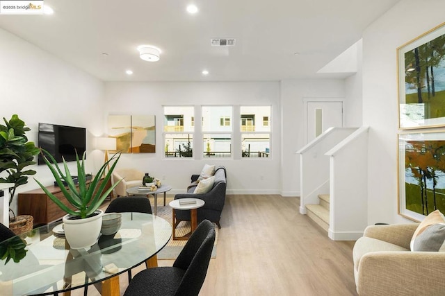 dining area with light hardwood / wood-style floors