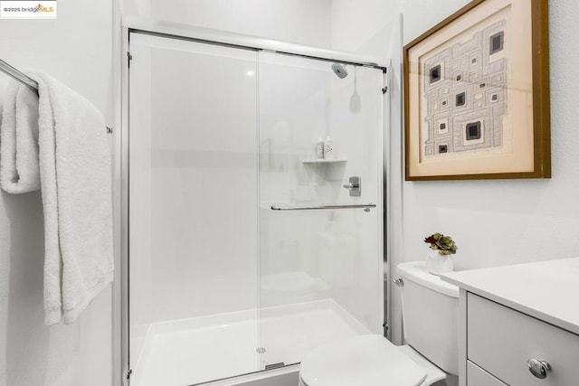 bathroom with toilet and walk in shower