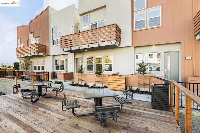 back of house featuring a balcony