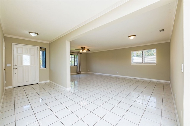 foyer with ceiling fan, light tile patterned floors, and ornamental molding