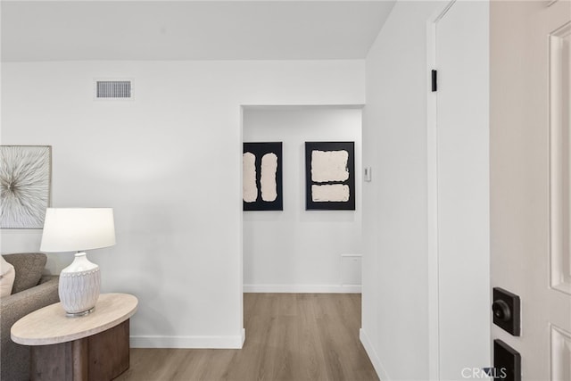 corridor featuring light hardwood / wood-style floors