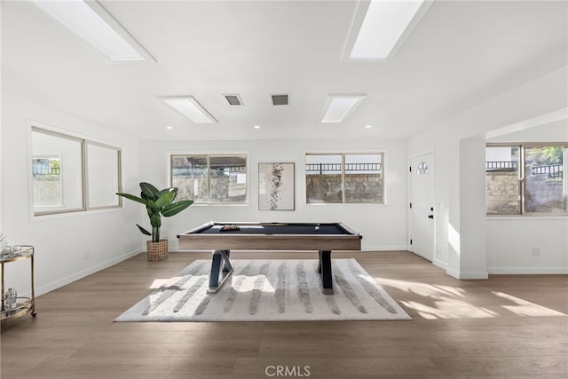 rec room with pool table and light hardwood / wood-style flooring