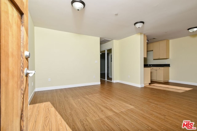 unfurnished living room with light wood-type flooring