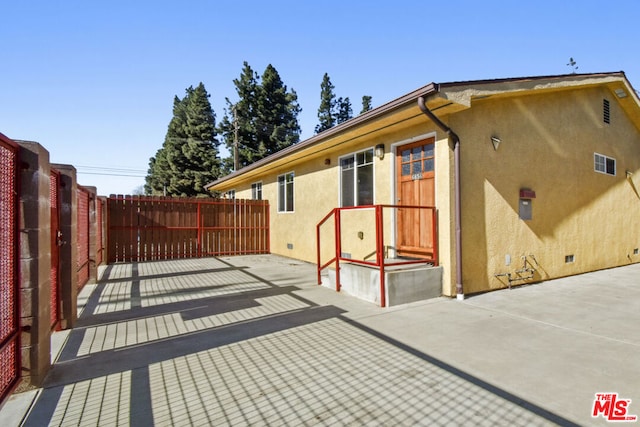 view of home's exterior with a patio area