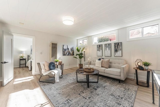 living room featuring wood ceiling and light hardwood / wood-style flooring