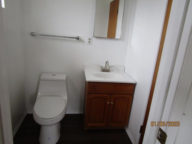 bathroom featuring toilet and vanity