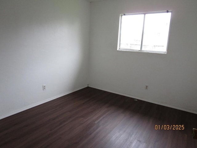 unfurnished room featuring dark hardwood / wood-style floors