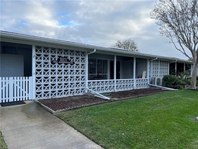 view of home's exterior featuring ac unit and a lawn