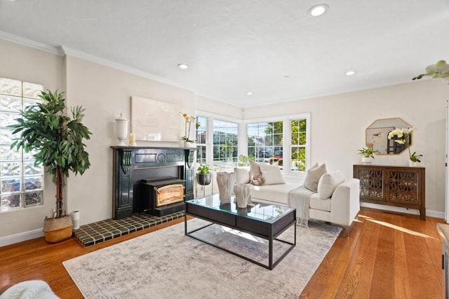 living room featuring hardwood / wood-style flooring and crown molding