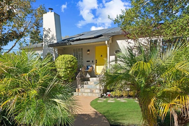 view of front of home with solar panels