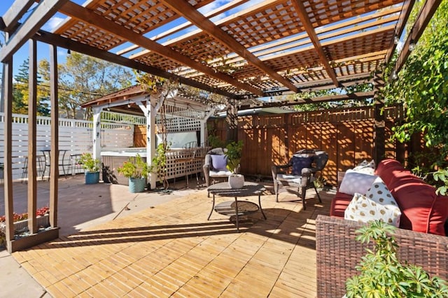 view of patio / terrace featuring a pergola and a hot tub