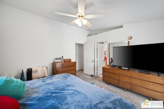 carpeted bedroom featuring ceiling fan and vaulted ceiling